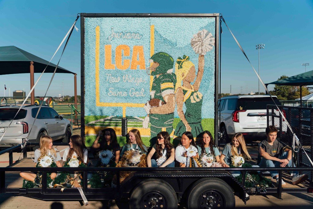 Legacy athletes carrying foam balls in the Homecoming parade
