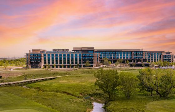 Omni PGA Frisco resort at sunset, overlooking the golf course