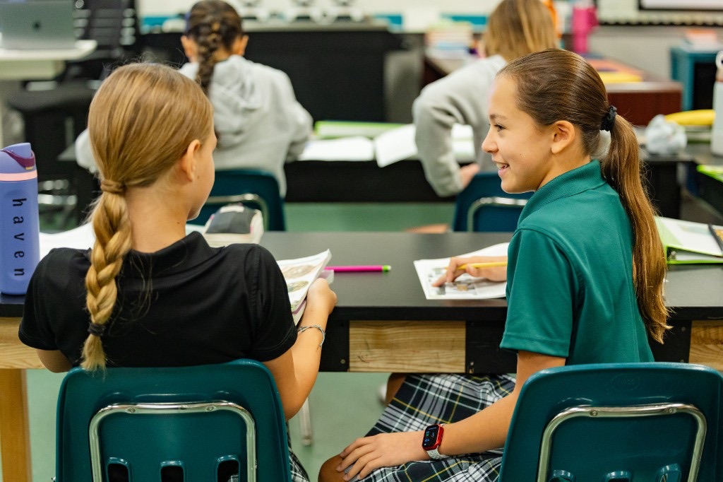 Two LCA students collaborating in a classroom, reflecting the lasting impact of faith-centered education