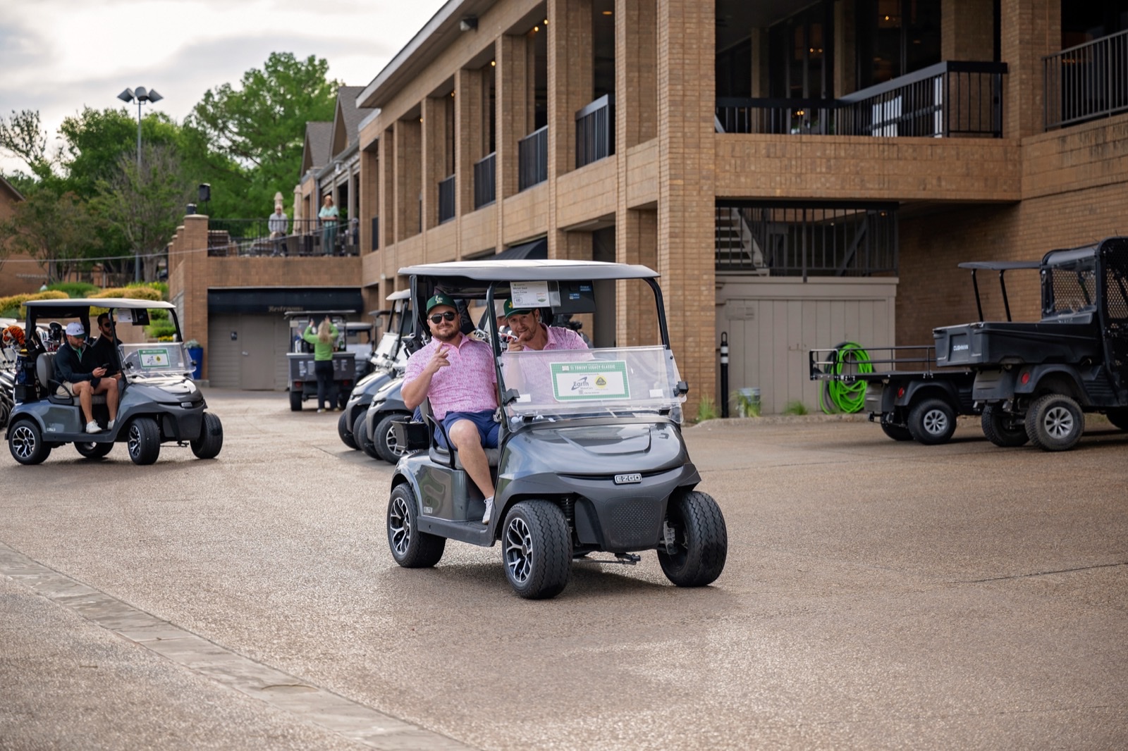 Golfers in a cart at Gleneagles clubhouse