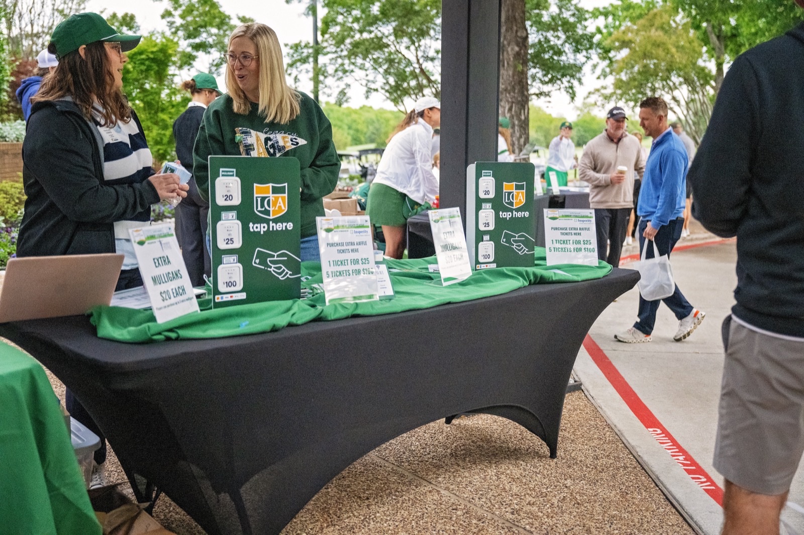 Tournament registration table with Legacy Christian Academy branding
