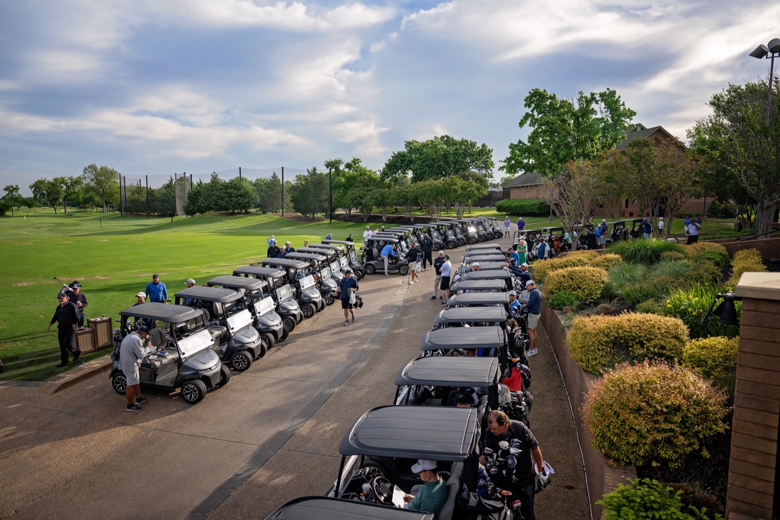 Golf carts lined up along the fairway at Gleneagles Country Club